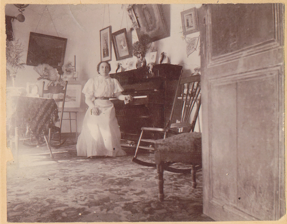 Concepción “Concha” (Luján) Newman (1884-1953), daughter of José Mauro Luján, with the first piano of El Paso